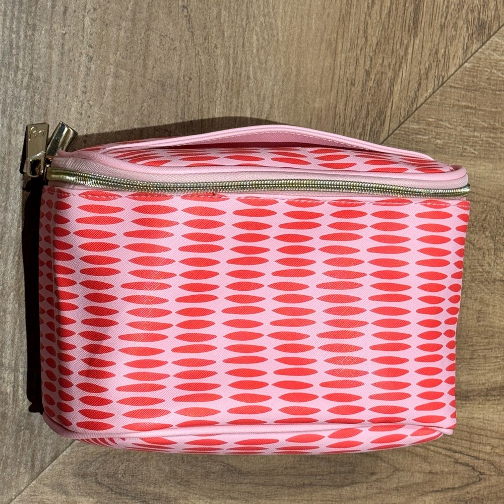 Stylish Pink and Red Patterned Women's travel toiletry bag. PurchasedNordstroms